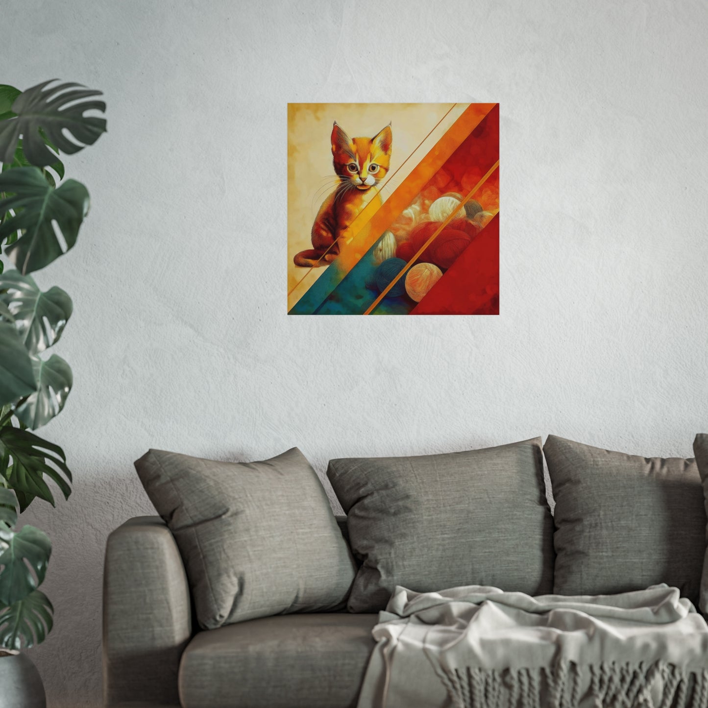 An orange kitten with vibrant yarn balls, framed by geometric lines and warm colors. Fine Art Poster hung above a grey sofa.